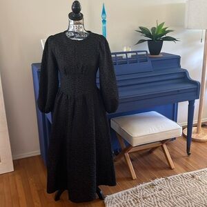 Black zip front dress.